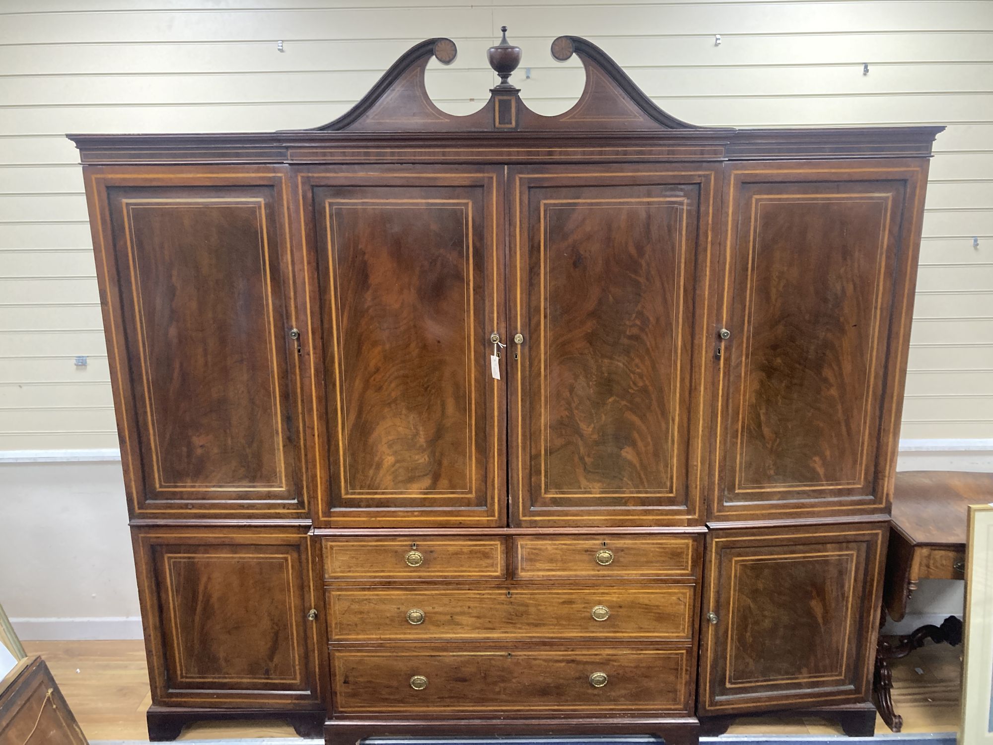 An Edwardian satinwood banded mahogany breakfront wardrobe, length 250cm, depth 65cm, height 230cm